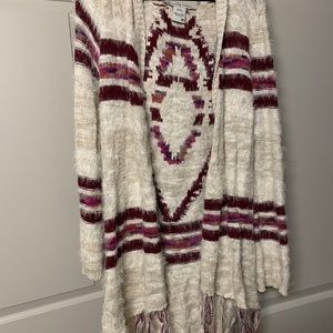 Patterned cardigan with fringe and hood